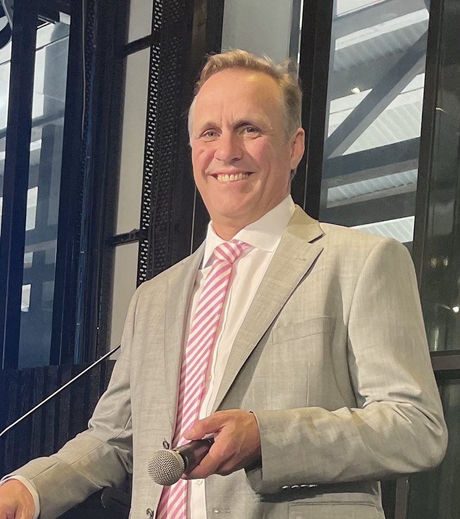 Duncan Schieb, host of Beer with Duncan, holding a microphone
